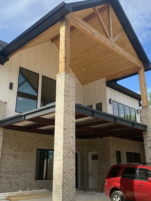 Structural steel framing supporting a covered exterior building area